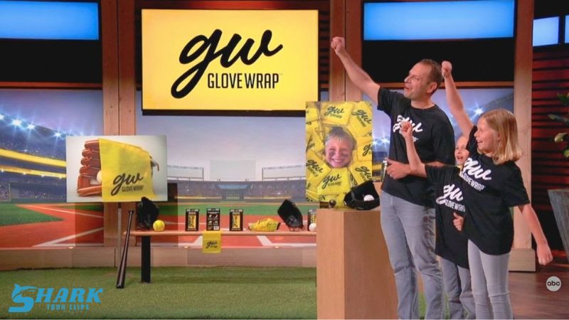 Family presenting GloveWrap on Shark Tank with a baseball-themed background, featuring the GloveWrap logo and personalized glove wraps with a child's photo